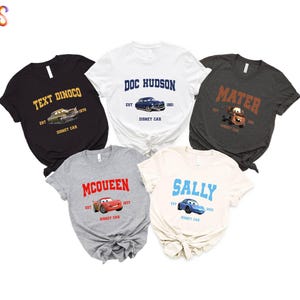 a group of four t - shirts with cars on them