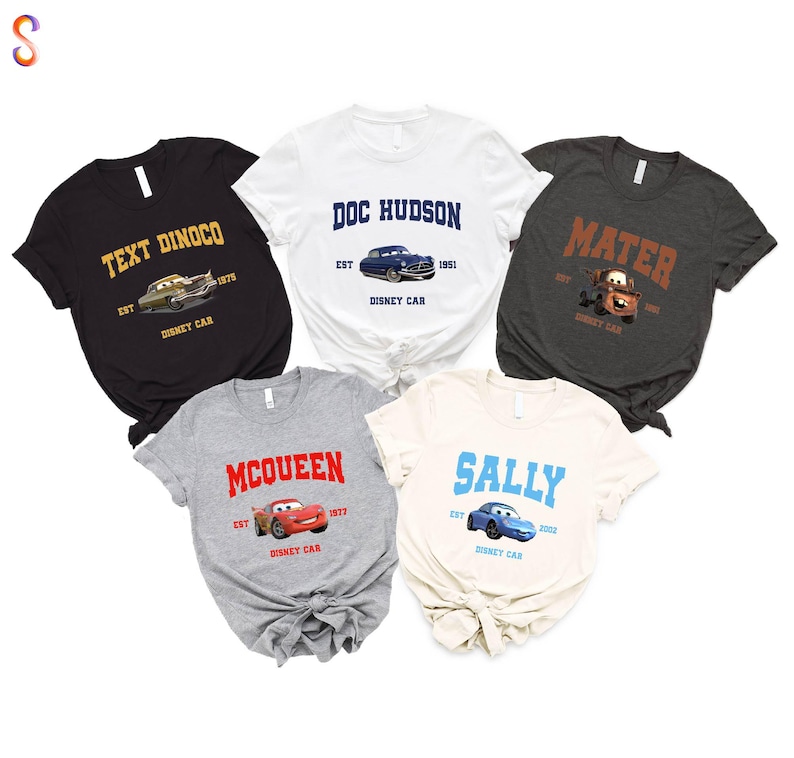 a group of four t - shirts with cars on them