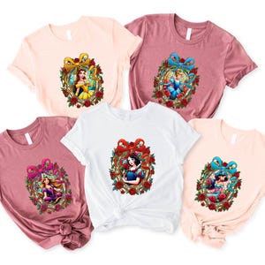 a group of three tshirts with cartoon characters on them