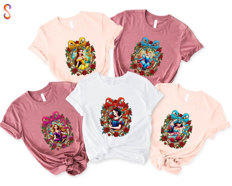a group of three tshirts with cartoon characters on them