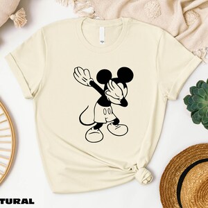 a t - shirt with a mickey mouse graphic on it