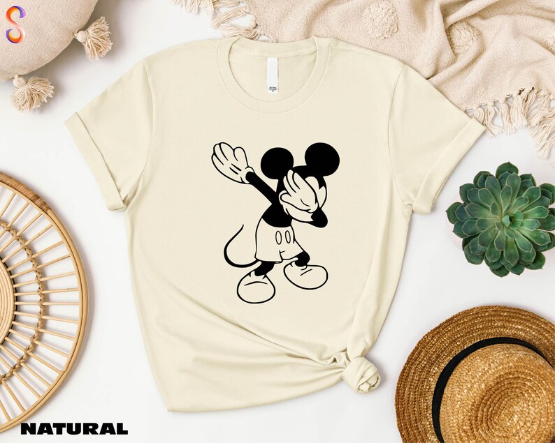 a t - shirt with a mickey mouse graphic on it