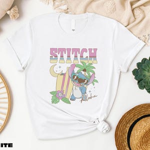 a white t - shirt with a cartoon character on it