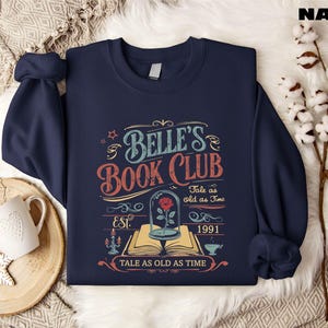 a book club sweatshirt sitting on top of a table