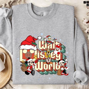 A gray sweatshirt with a graphic design featuring characters from Disney's "Walt Disney World" and the text "Walt Disney World" in a stylized font.