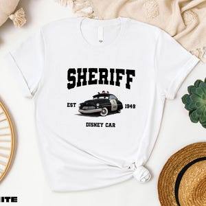 a t - shirt with the words sheriff on it