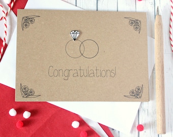 Glückwunschkarte zur Hochzeit, mit handgemachten Trauringen und Verzierung