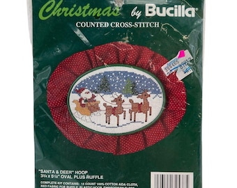Kit de punto de cruz navideño Bucilla "Santa y ciervo" con bastidor ovalado de 9,5 x 14 cm y volante