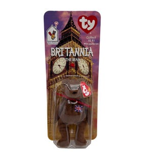 Può includere: Un orsacchiotto di peluche marrone chiamato "Britannia" con un emblema Union Jack, confezionato su una carta con il Big Ben. La confezione include il testo "Collect All 4!" e un'etichetta a cuore Ty.