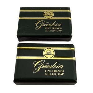 May include: Two bars of The Greenbrier Fine French Milled Soap. The soap bars are rectangular and wrapped in dark green paper. The packaging features gold lettering and a gold band. The brand name and product description are printed on the front.