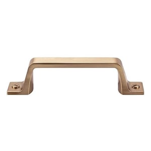 May include: A bronze-colored cabinet pull with a rectangular bar and square mounting plates. The handle is a simple, modern design with visible screw heads on each end. This hardware is suitable for drawers and cabinets.