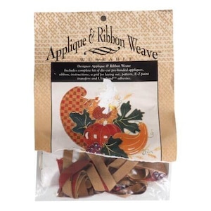 May include: A package containing a craft kit for making a fall-themed applique and ribbon weave project. The package includes pre-cut appliques, ribbon, instructions, a grid for laying out the design, a pattern, E-Z paint transfers, and Uld adhesive.