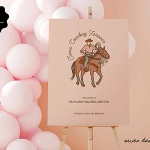 May include: A pink and white welcome sign with a cowboy riding a horse and the text "Tame Cowboy Forever" and "Welcome to Taylor's Bachelorette. Yeehaw Let's Celebrate."