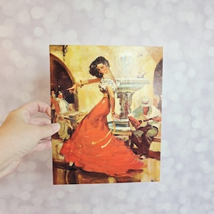 May include: A vintage print depicts a woman in a flowing red dress dancing in a courtyard. She wears a white top with gold jewelry. A man plays a guitar nearby. The background features a fountain and other figures.