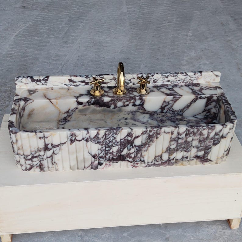 Modern Calacatta Viola marble bathroom sink with unique purple and white patterns, bringing sophistication to your space.