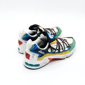 May include: White, black, blue, green, yellow, and red sneakers with black laces and the word "ASICS" on the side.