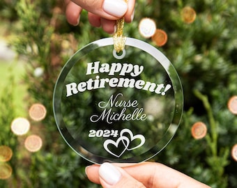 May include: Clear glass Christmas ornament with the text "Happy Retirement! Nurse Michelle 2024" and two intertwined hearts.