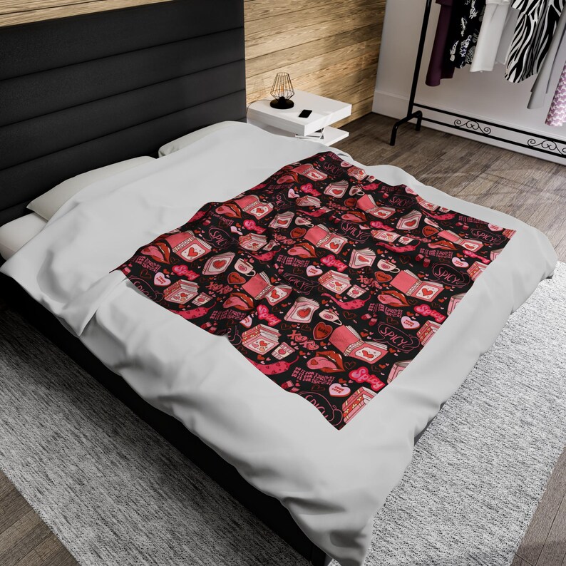 Pink and Black Reading Blanket for Book Nook. Cozy Throw Blanket covered in images of Spicy Romance Books, Coffee, Peppers, and Kisses.