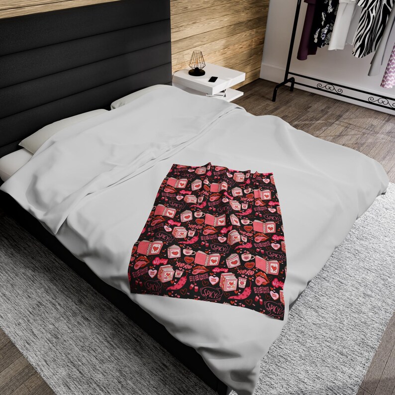 Pink and Black Reading Blanket for Book Nook. Cozy Throw Blanket covered in images of Spicy Romance Books, Coffee, Peppers, and Kisses.