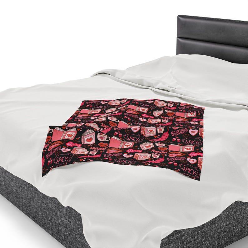 Pink and Black Reading Blanket for Book Nook. Cozy Throw Blanket covered in images of Spicy Romance Books, Coffee, Peppers, and Kisses.