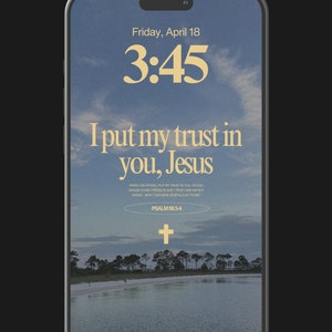 May include: A phone screen displaying a blue sky with clouds and a quote about trust in God. The text reads "I put my trust in you, Jesus" and includes a Bible verse from Psalm 56:3-4. The time is 3:45 and the date is Friday, April 18.
