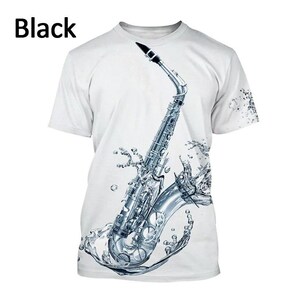 May include: White t-shirt with a silver saxophone design, depicted with water splashes. The word "Black" is printed in the upper left corner. The saxophone is silver and black.