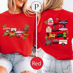 a red t-shirt with various car-related logos and text, including a red car, a red radiator, and a red tire.