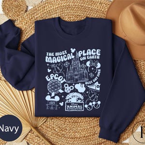 a navy blue sweatshirt with the words the most magic place on it