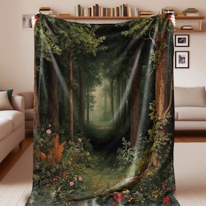 May include: A forest-themed blanket featuring a detailed painting of a path winding through a lush forest. The design includes tall trees, vibrant green foliage, and colorful flowers along the path. The blanket is held up, showcasing the full artwork.