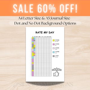 Peut inclure: Une page de journal blanche avec le texte "RATE MY DAY" et une grille pour les évaluations quotidiennes. La page comprend une légende codée par couleur pour les niveaux d'évaluation, de 1 à 5 étoiles, et une icône de pouce levé. Le texte "SALE 60% OFF!" est également présent.