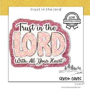 May include: A pink glittery sticker featuring the text Trust in the Lord with All Your Heart in a bold font. The letters are filled with a light pink background and a small white daisy pattern. The sticker has a thick, textured pink glitter border.
