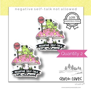 May include: Two stickers featuring a green frog holding a stop sign, sitting on a pink mushroom with yellow spots. The text "NEGATIVE SELF-TALK not allowed" is below the mushroom. The image also includes a "Quantity 2" banner.