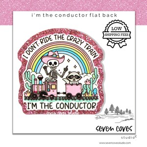 May include: Pink glitter sticker with a skeleton wearing a cowboy hat and riding a train with a raccoon. The sticker says "I don't ride the crazy train I'm the conductor".