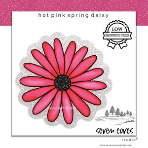 May include: A hot pink daisy illustration with a black center and a white glittery scalloped border. The text "hot pink spring daisy" is at the top. The image also includes the text "seven coves studio".