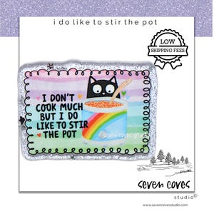 May include: A rectangular sticker with a glittery border features a cartoon cat stirring a pot with a rainbow design. Text reads "I don't cook much but I do like to stir the pot." The sticker also has a "Low Shipping Fees" badge.