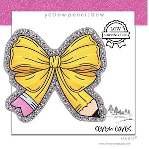 May include: A yellow pencil bow with a silver glitter border. The bow is shaped like a pencil with a pink eraser tip and a black lead point. The text reads yellow pencil bow, low shipping fees, and seven coves studio at the bottom of the card.