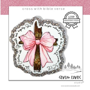 May include: An illustration of a wooden cross adorned with a pink bow. The cross is surrounded by a glittery border and features script with a bible verse. The text "cross with bible verse" is at the top.