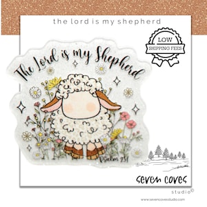 May include: A whimsical sticker featuring a cartoon sheep with the text "The Lord is my Shepherd." The sheep is surrounded by colorful flowers and sparkles. The sticker also includes the text "Psalm 23:1" and the brand name "seven coves studio."