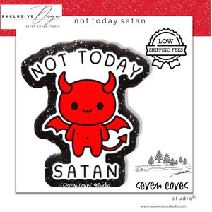 May include: A sticker with a red devil illustration with the text "NOT TODAY SATAN". The devil has horns, wings, and a tail. The sticker has a black glitter border and the words "seven coves studio" at the bottom.