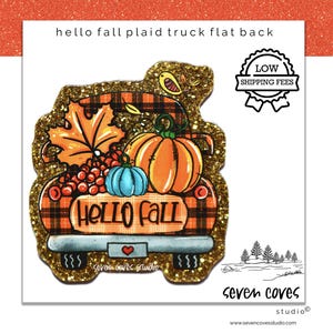 May include: A glittery fall-themed flat back featuring a plaid truck bed filled with pumpkins, leaves, and berries. The text "Hello Fall" is displayed on the truck bed. A small heart and the words "seven coves studio" are also visible.