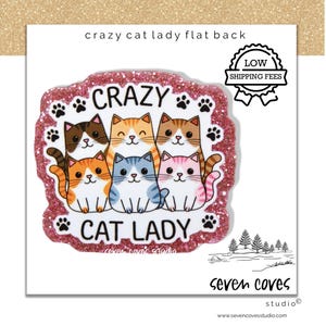 May include: A pink glittery sticker with the text "CRAZY CAT LADY" and illustrations of six cartoon cats. The sticker has a white background and the words "LOW SHIPPING FEES" are also visible.