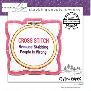 May include: A circular wooden embroidery hoop containing white fabric with the red text CROSS STITCH and the purple text Because Stabbing People Is Wrong. The hoop is framed by a pink glittery border on a white background with additional text.