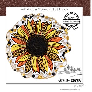 May include: A flat back sunflower embellishment featuring yellow and orange petals with leopard print accents and a dark center. The piece is set against a clear, irregular base filled with black, white, and gold glitter dots. Text reads wild sunflower flat back.