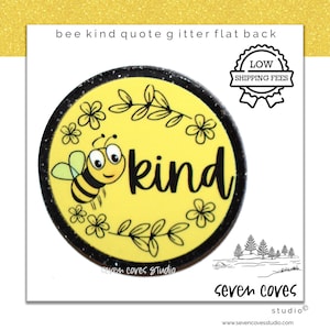 May include: A yellow round sticker with a black border and a bee with black and yellow stripes. The bee is surrounded by flowers and leaves. The text "bee kind" is written in black letters.