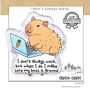 May include: A whimsical sticker featuring a cartoon capybara working on a laptop with a carrot icon. The text reads "I don't always work, but when I do I make sure my boss is around." The sticker has a glittery border and a small forest illustration.