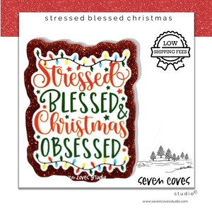 May include: A festive Christmas-themed sticker with a glittery red border. The sticker features the words "Stressed, Blessed, Christmas, Obsessed" in red and green, with a string of lights and stars. The design includes a "Low Shipping Fees" badge.