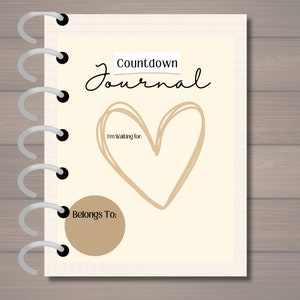 May include: A printable 8.5" x 11" journal with a beige cover. The cover has a handwritten title "Countdown Journal" and a large hand-drawn heart. The text "I'm Waiting for:" is written below the heart. There is a beige circle with the text "Belongs To:" below the heart.