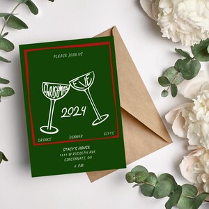 May include: Green Christmas Eve party invitation with red border. Two white wine glasses clinking together with the words "Christmas Eve" and "2024" written on them. The text "Please join us" is at the top of the invitation. The text "Drinks, Dinner, Gifts" is at the bottom of the invitation. The text "Stacy's House, 1234 W Rudolph Ave, Cincinnati, OH, 6 PM" is in the center of the invitation.