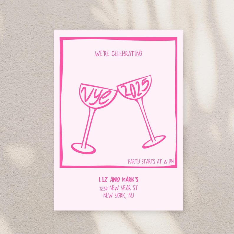 May include: Pink New Year's Eve party invitation with a graphic of two champagne glasses clinking. The glasses say "Vye" and "2025". The text reads "We're celebrating", "Party starts at 8 PM", "Liz and Mark's", "1234 New Year St", "New York, NY".