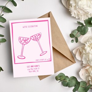 May include: Pink and white New Year's Eve party invitation with a graphic of two champagne glasses clinking. The text reads "We're celebrating Nye 2025" and "Party starts at 8 PM". The invitation also includes the host's name and address: "Liz and Mark's 1234 New Year St New York, NY".